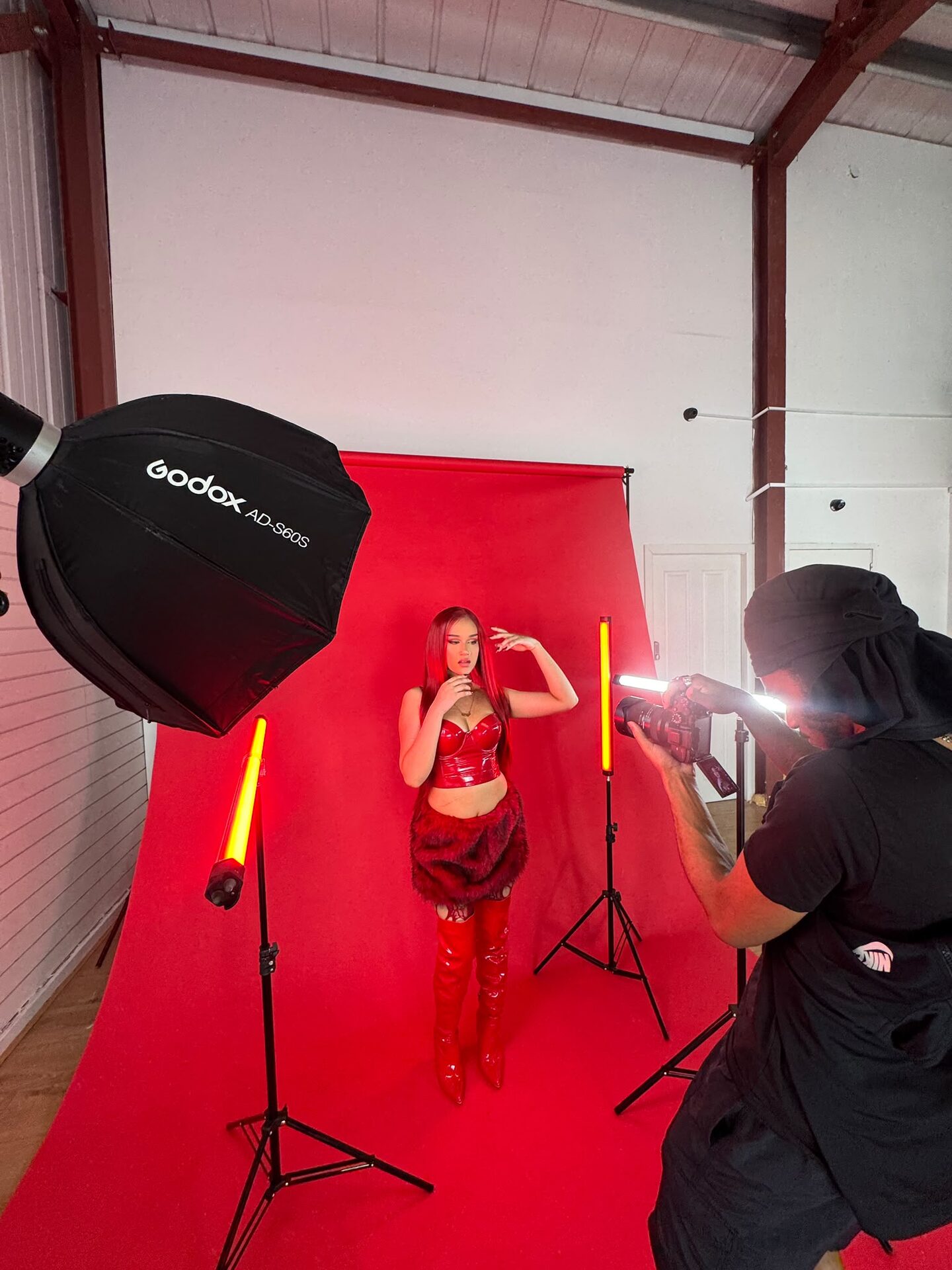 Close view of the red backdrop shoot with a softbox and red tube lights